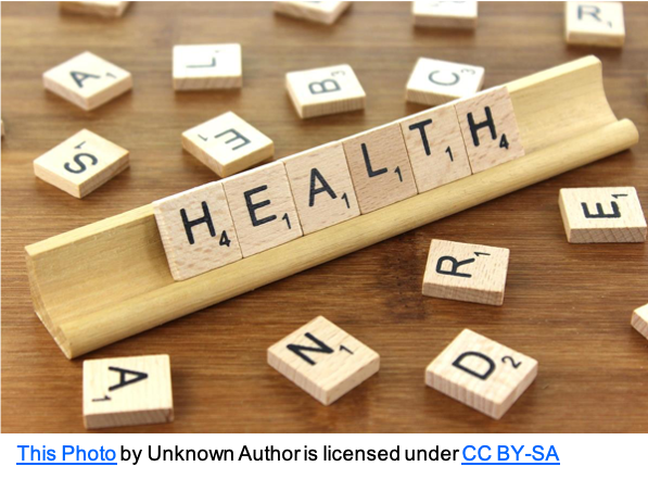 Health on rack in scrabble tiles with scatter of other tiles  